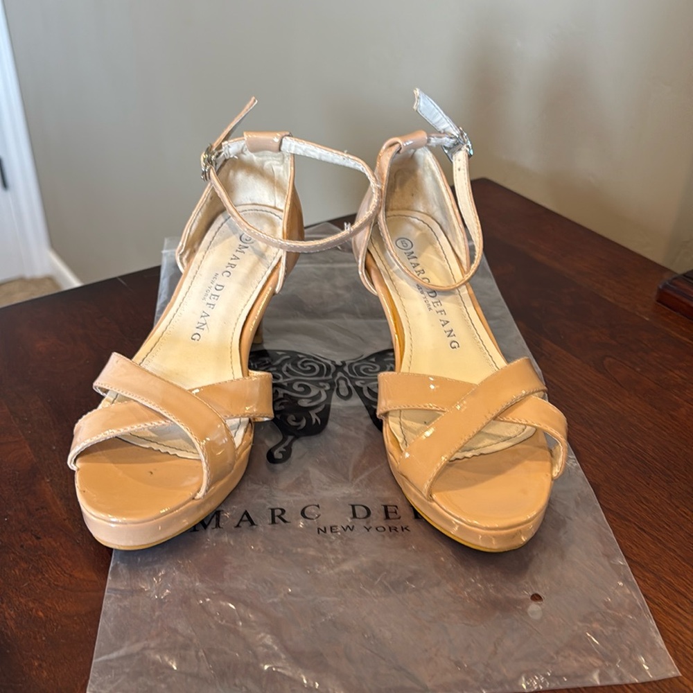 Marc Defang, Size 5, Gently Used. Minor scuff, see picture. Nude Sandal Heel.